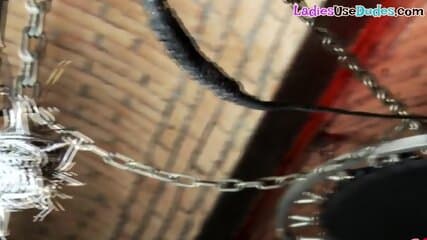 Uniformed dominas pegging and spanking sissy barmens ass
